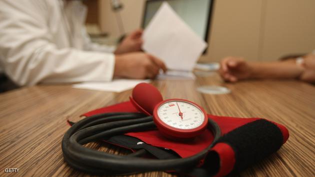 BERLIN, GERMANY - SEPTEMBER 05: A doctor speaks to a patient as a sphygmomanometer, or blood pressure meter, lies on his desk on September 5, 2012 in Berlin, Germany. Doctors in the country are demanding higher payments from health insurance companies (Krankenkassen). Over 20 doctors' associations are expected to hold a vote this week over possible strikes and temporary closings of their practices if assurances that a requested additional annual increase of 3.5 billion euros (4,390,475,550 USD) in payments are not provided. The Kassenaerztlichen Bundesvereinigung (KBV), the National Association of Statutory Health Insurance Physicians, unexpectedly broke off talks with the health insurance companies on Monday. (Photo by Adam Berry/Getty Images)