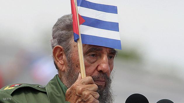 (FILES) Picture dated 01 May 2006 showing Cuban President Fidel Castro with a national banner during the May Day ceremony in Havana. Fidel Castro resigned on February 19, 2008 as president and commander in chief of Cuba in a message published in the online version of the official daily Granma AFP PHOTO/Adalberto ROQUE (Photo credit should read ADALBERTO ROQUE/AFP/Getty Images)