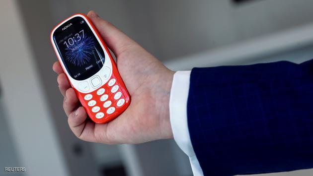 A model holds the Nokia 3310 in London, Britain February 24, 2017. Picture taken February 24, 2017. REUTERS/Eddie Keogh