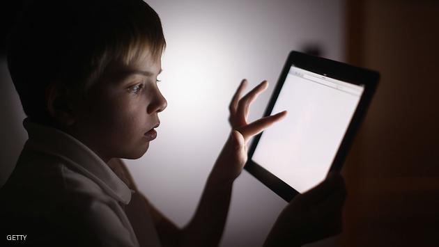 KNUTSFORD, UNITED KINGDOM - NOVEMBER 29: In this photograph illustration a ten-year-old boy uses an Apple Ipad tablet computer on November 29, 2011 in Knutsford, United Kingdom. Tablet computers have become the most wanted Christmas present for children between the ages of 6-11 years. Many parents are having to share their tablet computers with their children as software companies release hundredes of educational and fun applications each month. (Photo by Christopher Furlong/Getty Images)