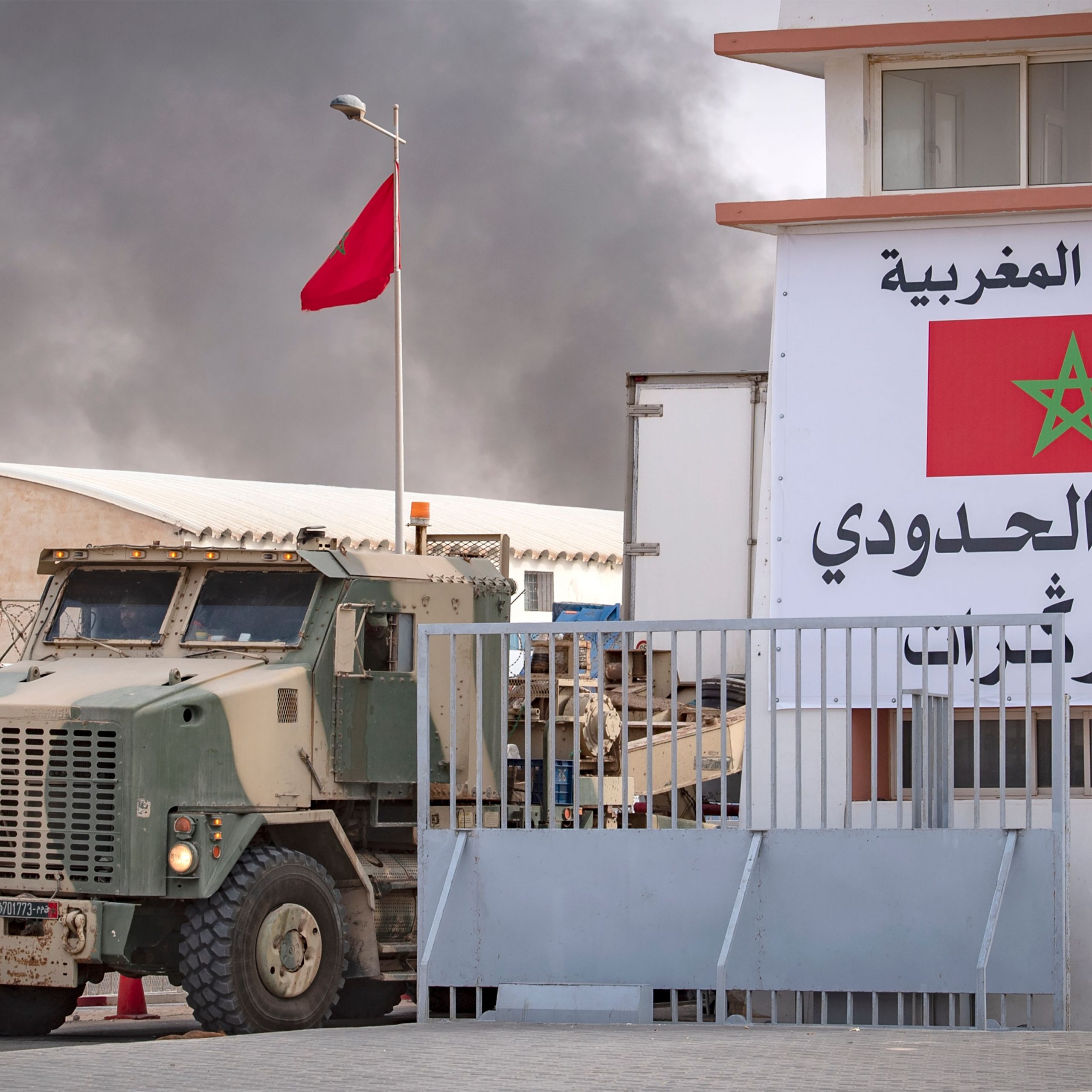 A picture shows smoke from burning waste behind a Moroccan border crossing point between Morocco and Mauritania in Guerguerat located in the Western Sahara, on November 24, 2020, after the intervention of the royal Moroccan armed forces in the area. - Morocco in early November accused the Polisario Front of blocking the key highway for trade with the rest of Africa, and launched a military operation to reopen it. (Photo by Fadel SENNA / AFP) (Photo by FADEL SENNA/AFP via Getty Images)