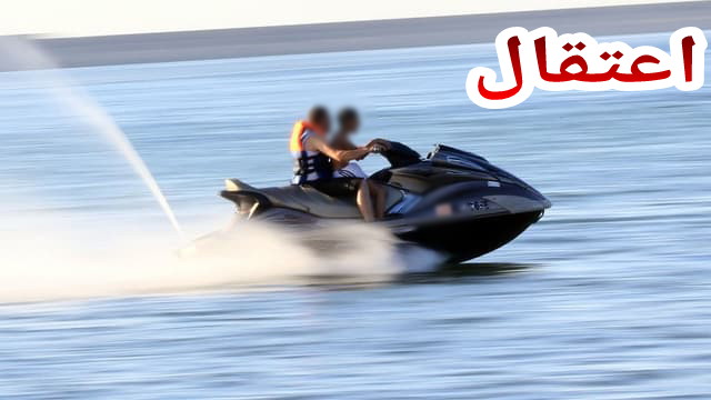 Libyans ride a jet-ski in the Mediterranean sea in the capital Tripoli on August 3, 2017. / AFP PHOTO / MAHMUD TURKIA